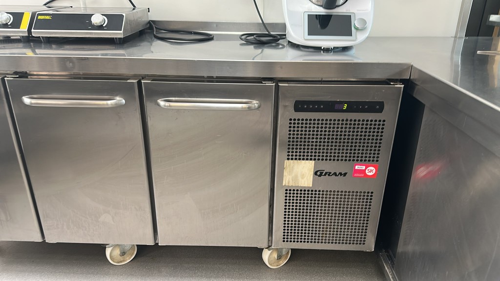 GRAM under-counter fridge with Buffalo induction hobs on the worktop