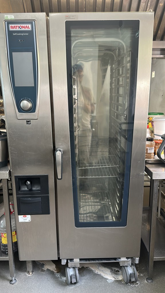 Site Rational SelfCookingCenter with screen, dial, mobile rack and rinse hose