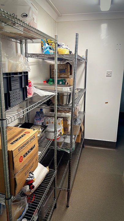 Dry store wire shelving with labelled goods